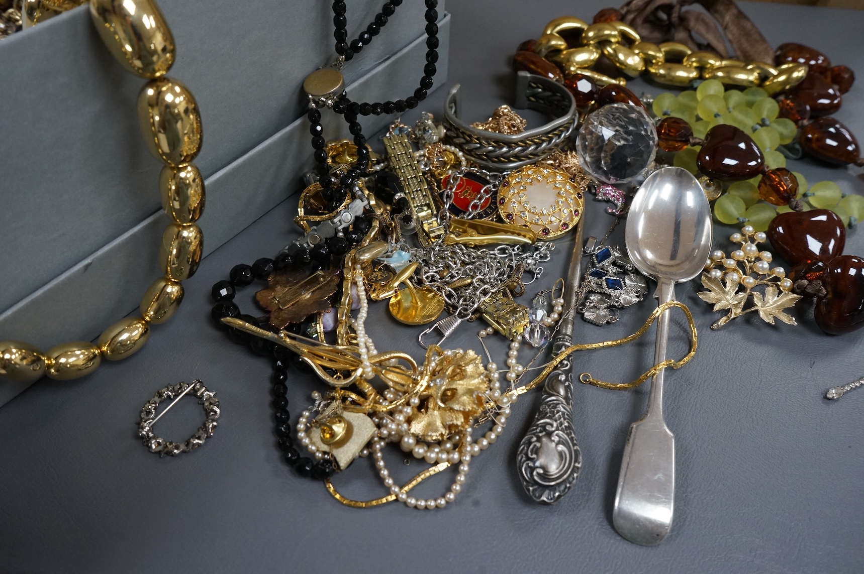 A quantity of assorted recent costume jewellery and two silver handled button hooks.